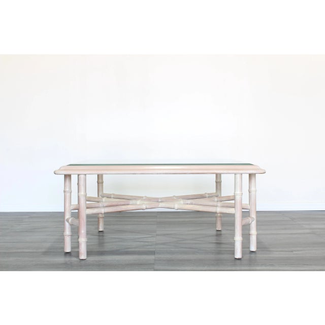 Vintage faux bamboo coffee table with glass top This table is solid built and is great vintage condition Dimensions; 39"...