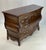 Crafted with a dramatic serpentine front and deeply bowed "bombé" sides, this French Provincial style bombé chest of...
