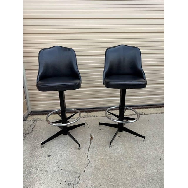 Pair of Mid Century Atomic Style Swivel Black Vinyl & Metal Bar Stools by Modern Stool Co. Real mid century, sturdy and...