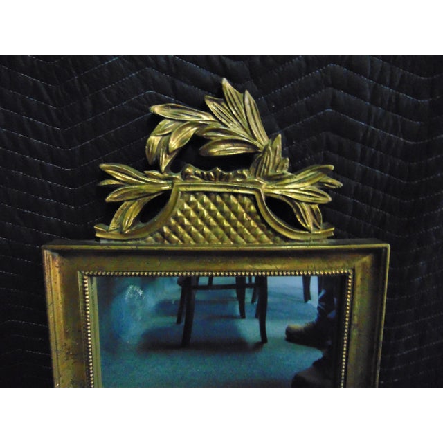 Italian style mirror, gilt finished frame with leaf accents on crest