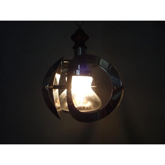 Playful chrome hanging lamp from Mazzega Italy. Multi-colored lampshade in glass. Fully functional and in good original...