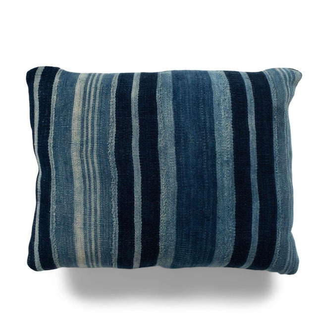 Rich faded indigo stripe cushion made from vintage handwoven and hand-dyed slubby cotton fabric. This decorative pillow...
