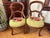 This pair of 19th century antique Victorian mahogany balloon back parlor side chairs have original floral needlepoints,...