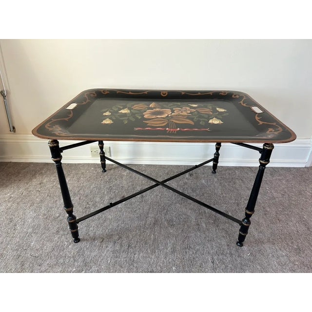 A detachable serving tray top with a beautifully polychrome decorated floral motif and a faux bamboo, black painted and...