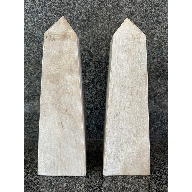 Fabulous vintage pair of marble obelisks, made in Italy. Beautiful warm shades of tan, off-white, oatmeal, blonde and...