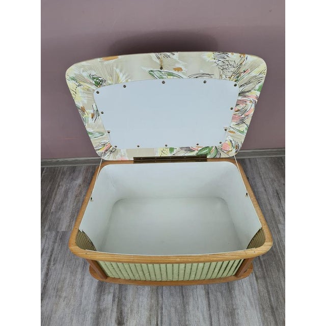 A stylish ottoman with storage from the 1960s–70s, designed in the post-war modernist style. This piece combines the...