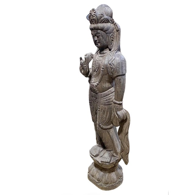 This large, hand carved Quan Yin statue made of stone is suitable for display both indoors and outdoors. As the goddess of...