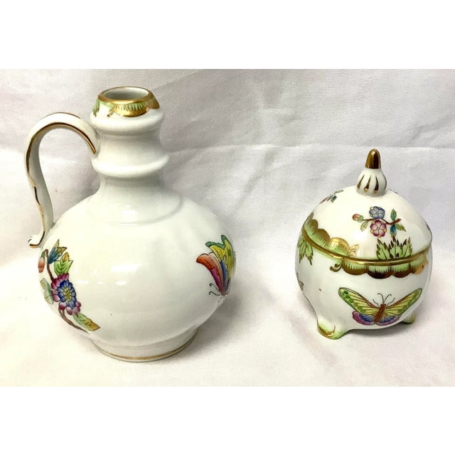 Two piece set of vintage Queen Victoria porcelain china. One is a small trinket dish with lid, one is small vase. Both...