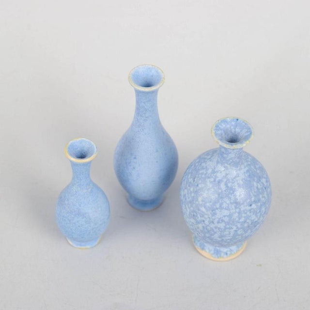 Per Liljegren, set of three miniature vases. Set of three hand-thrown miniature stoneware vases with elegant organic forms...