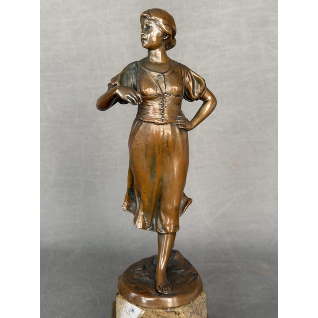 19th-century sculpture, young woman made of calamine, unsigned, missing a rod or similar item possibly of french origin,...