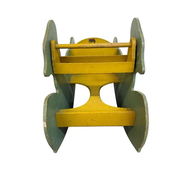 Bring nostalgic Disney charm into your home with this vintage Walt Disney Enterprises Donald Duck wooden rocker. Featuring...