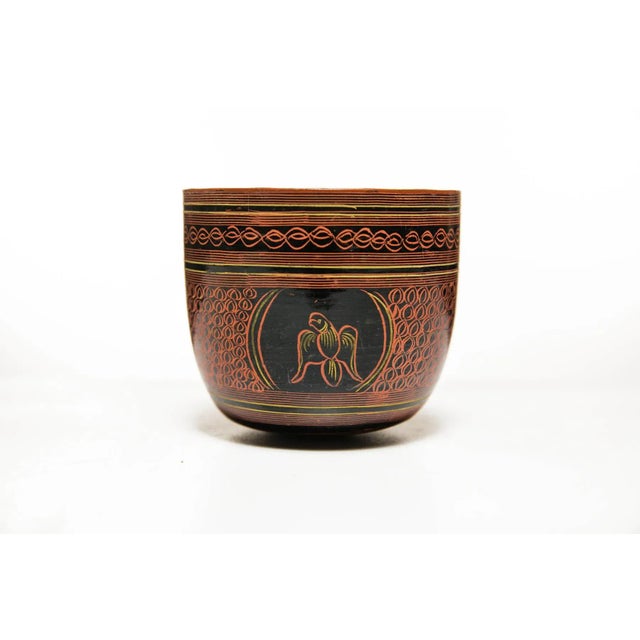 A rare 20th-century Burmese lacquerware table top cup in traditional Burmese style with a parrot motif with classic red...