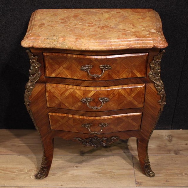 A pair of French bedside tables dating from the second half of the 20th century. These Louis XV-style pieces feature...