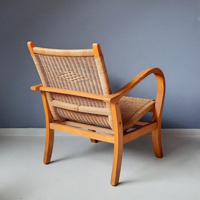This 1930s Bauhaus style armchair (Flechtsessel) has a wooden (beech) frame and is upholstered with cane. The German...