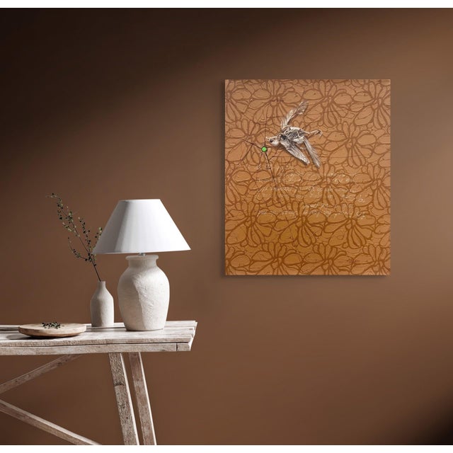 This artwork depicts a central figure of a skeletal insect, intricately rendered against a rich mustard-colored background...