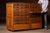 Large quarter-sawn oak flat file cabinet with sixteen shallow drawers arranged in two vertical banks, retaining dark...