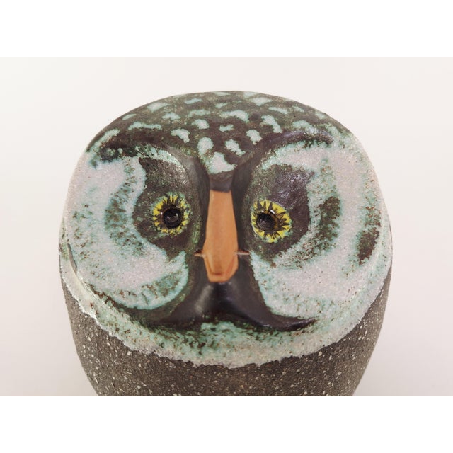 Decorative ceramic owl figurine by Thomas Hellström for Nittsjö, Sweden. Model 6008 designed in the 1960s. The owl is...