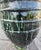 Make a dramatic statement with this handcrafted Moroccan pottery urn, featuring a rich deep-green glaze accented by...