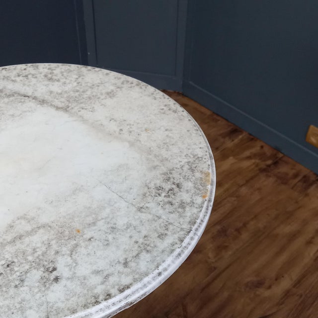 Authentic 19th-century Italian antique table with a white marble top and wrought-iron base This magnificent 19th-century...