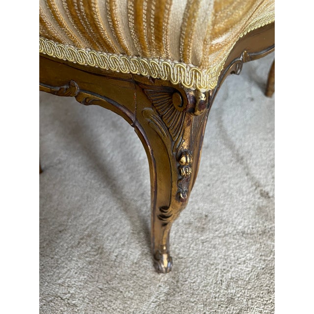 Elevate your space with this opulent Louis XVI-style ottoman bench, crafted circa 1930s and steeped in European elegance....