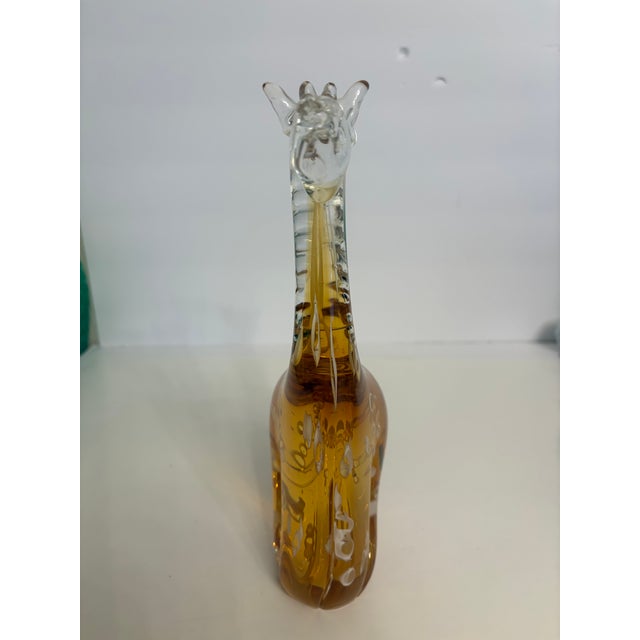 The hand blown glass giraffe is a prime example of the well crafted beauty the artians achieve in Murano, Italy. It shows...