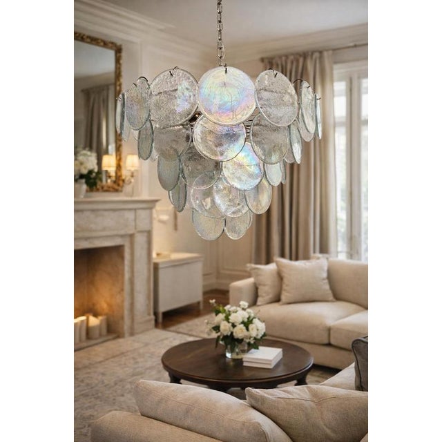 Italian murano chandelier. The chandelier has 57 fantastic iridescent grit discs in a nickel metal frame\. The glasses are...