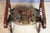 Napoleon III curule chair upholstered in antique velvet. This chair has the unique feature of transforming into a prie-...