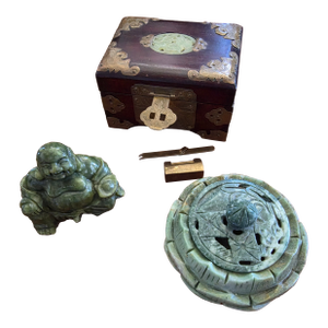 Small Grouping of Asian Items With Green Stone