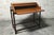A 1960s proserpio brothers drop-leaf desk. An elegant and modern design in solid wood. The rolling top, or drop-leaf,...