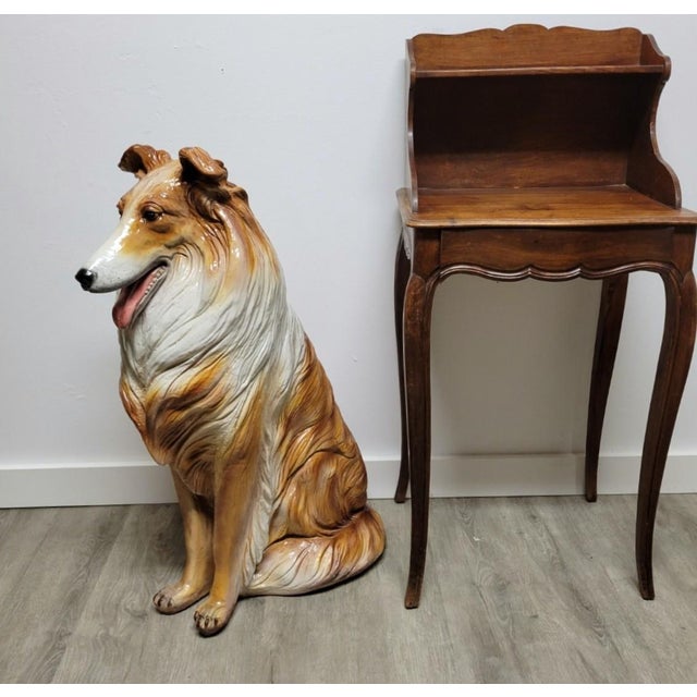 A striking life-size Italian ceramic sculpture of a seated Rough Collie. Modeled with a high degree of naturalism, the...