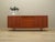 The sideboard was made in the 1970s, Danish production. The structure is covered with teak veneer. The legs are made of...