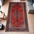 This antique Turkish Oushak hand‑knotted rug displays a central medallion motif with an open floral field and a detailed...