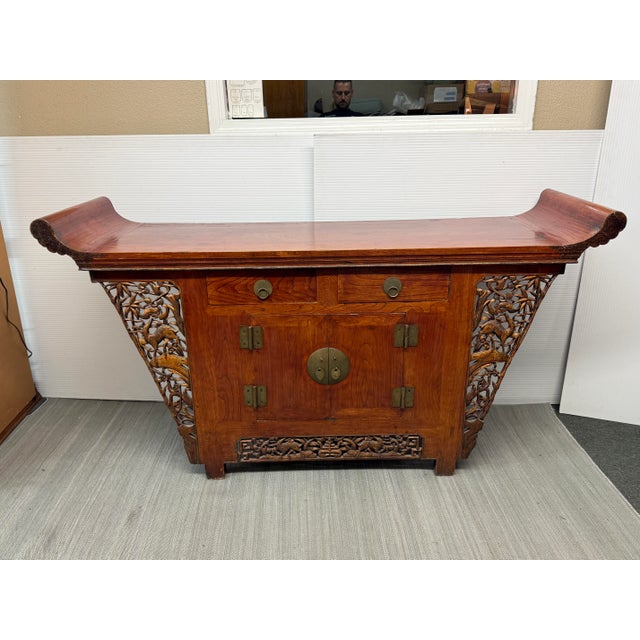 Design Plus Gallery presents a Tongzhi Style Altar Elmwood Cabinet. This altar has ornately pierce-carved and gilt...