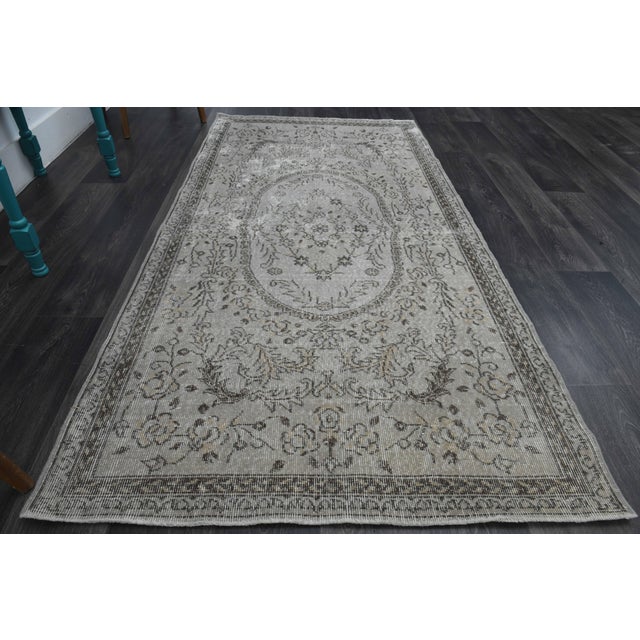 Vintage Hand-Knotted area rug is a semi-antique vintage area rug. The '70s Eastern region of Anatolia's unique rug is...