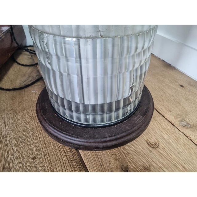 Holophane light column originally mounted on a lamp post. Transformed into a table lamp, the base and top are in solid...