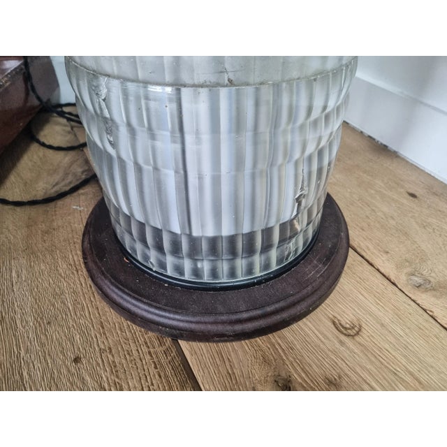 Holophane light column originally mounted on a lamp post. Transformed into a table lamp, the base and top are in solid...