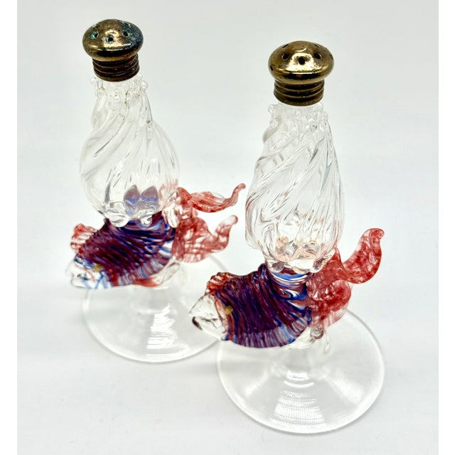 An exceptional pair of signed Gazelle Art Glass hand-blown tropical fish salt and pepper shakers, acquired from a private...