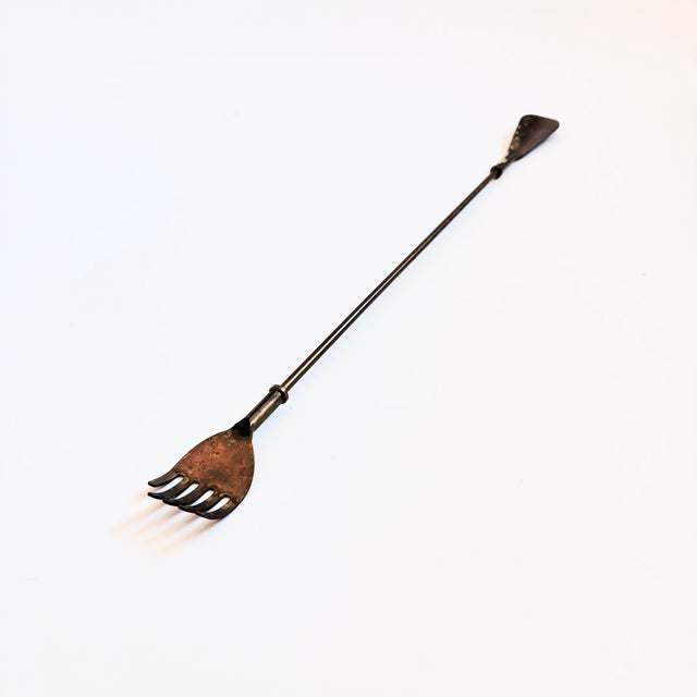 A long vintage brass back scratcher shoe horn. Features a hand shape back scratcher on one end with the shoe horn on the...