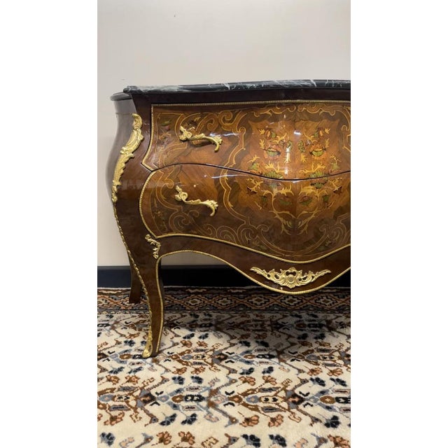 This stylish french-style chest of drawers blends classic design with everyday practicality. With elegant marquetry,...