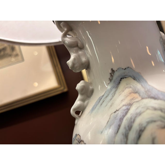 beautiful chinese hand painted vase lamp with an added contemporary shade. works great, has poetry on the back, and is...