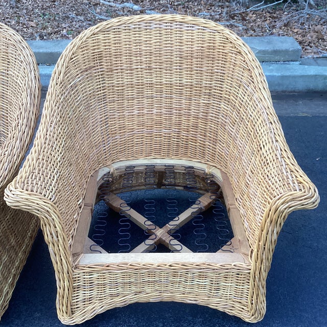 Striking pair of sculptural vintage rattan lounge chairs, crafted in the style of McGuire Furniture Company, circa 1970s,...