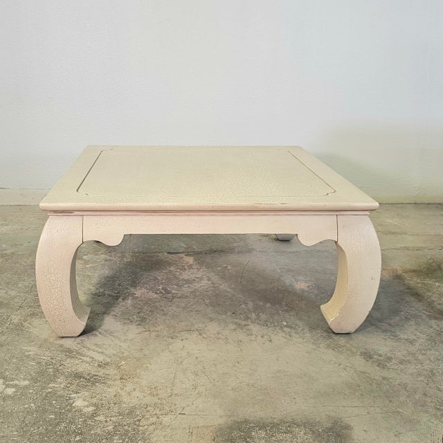 The table sits low and quiet, its form a graceful nod to Ming design, where curves soften the weight of square proportion....