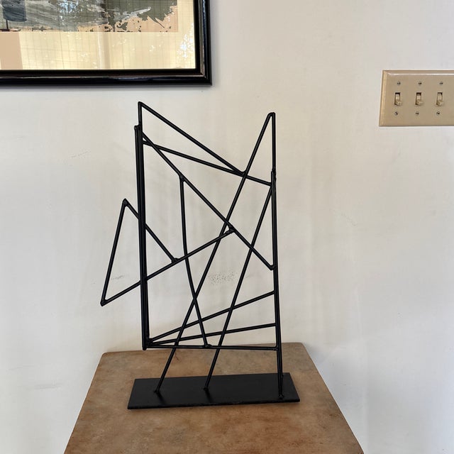 Welded steel rod abstract sculpture by Iowa Sculptor David Owens. This piece has been welded to a metal plate for display...