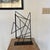 Welded steel rod abstract sculpture by Iowa Sculptor David Owens. This piece has been welded to a metal plate for display...