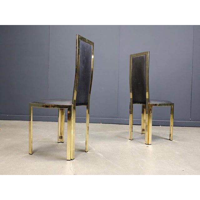 Set of six elegant dining room chairs with shiny golden frames and a textured vinyl upholstery; These 'seventies glam'...