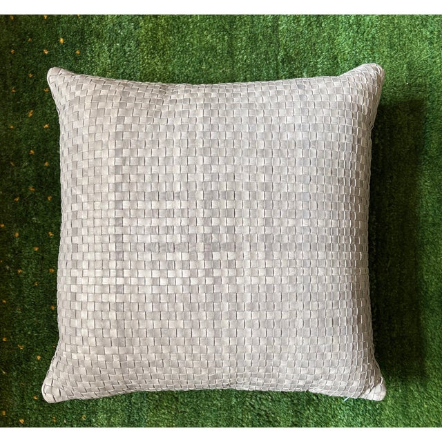 Add refined texture to your space with this Lulu & Georgia decorative pillow, crafted in a soft blue woven leather design....