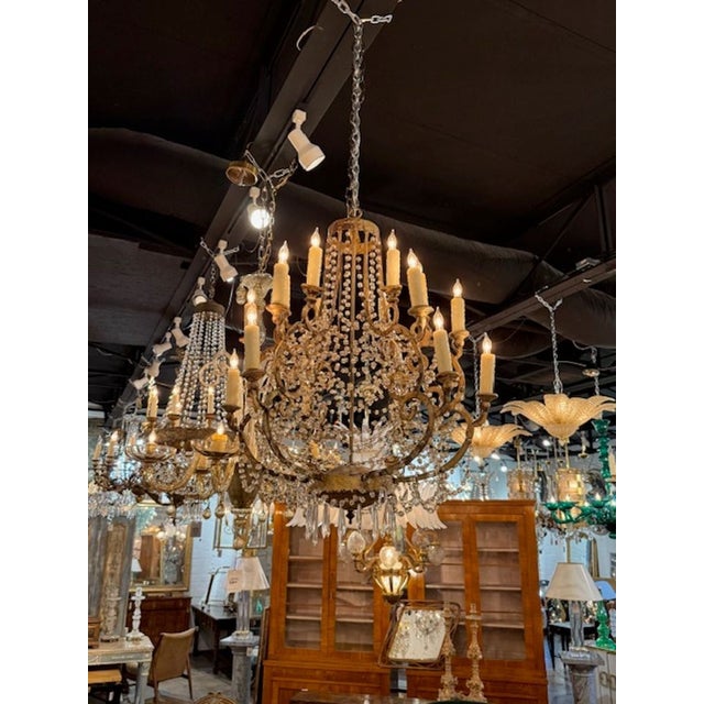18th c Italian chandelier. An 18th‑century Italian beaded chandelier evokes the theatrical elegance of late‑Baroque and...