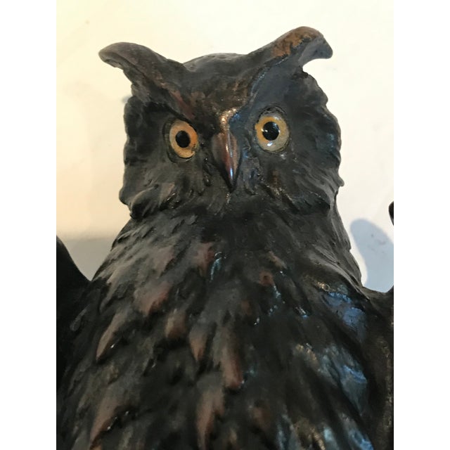 The bronze owl may be part of a pair of bookends but I have only one. Owl has amber - yellow glass eyes Total size: is...