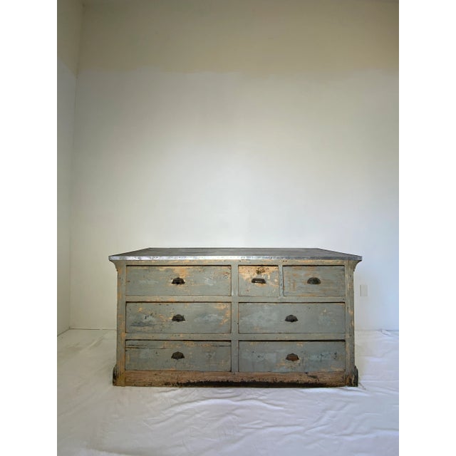 Early 19 C light blue painted store counter with 7 drawers, one drawer with shield emblem key plate iron pull handles...