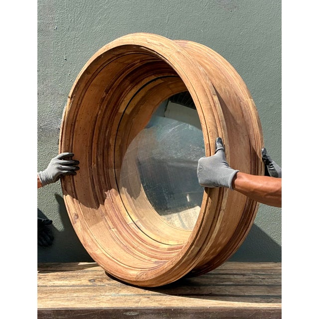 This monumental convex mirror from Arteriors is a masterpiece of architectural scale and organic texture. Its...